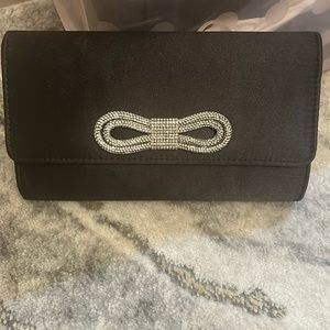 Black satin purse with bedazzled bow